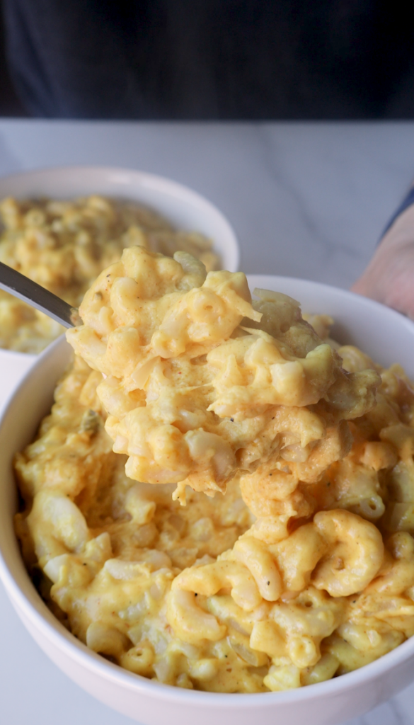 a bowl of Afghan Macaroni and Cheese with jalapeños next to it